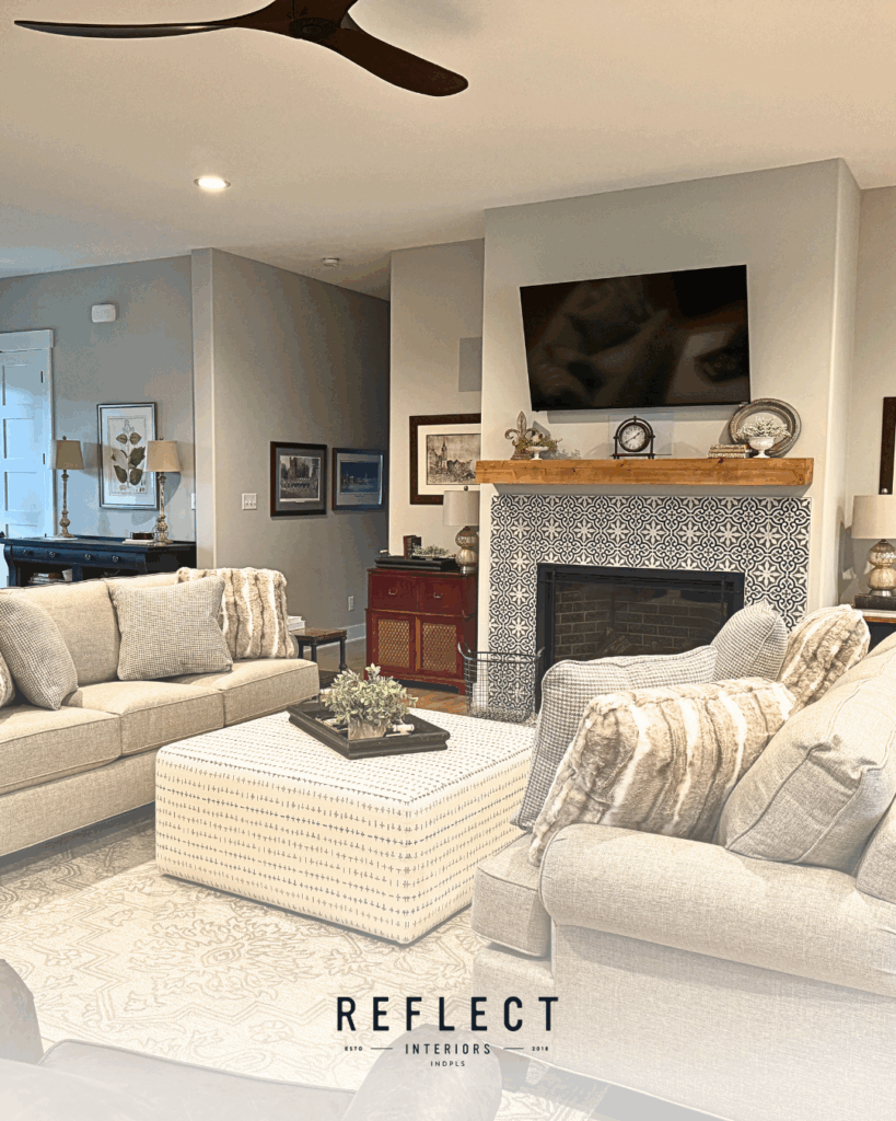 A cozy living room featuring a fireplace and a television, creating a warm and inviting atmosphere.